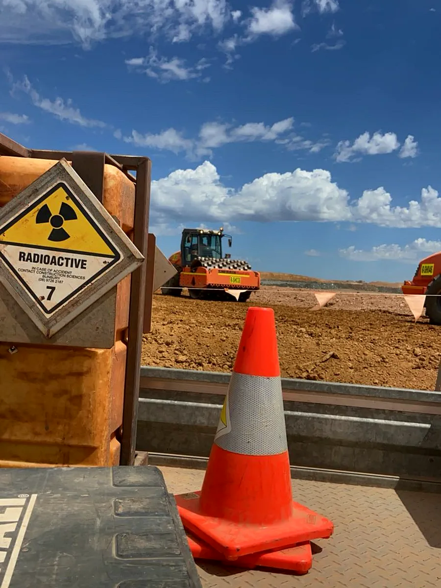 Nuclear density meter kit and cones with rollers compacting behind